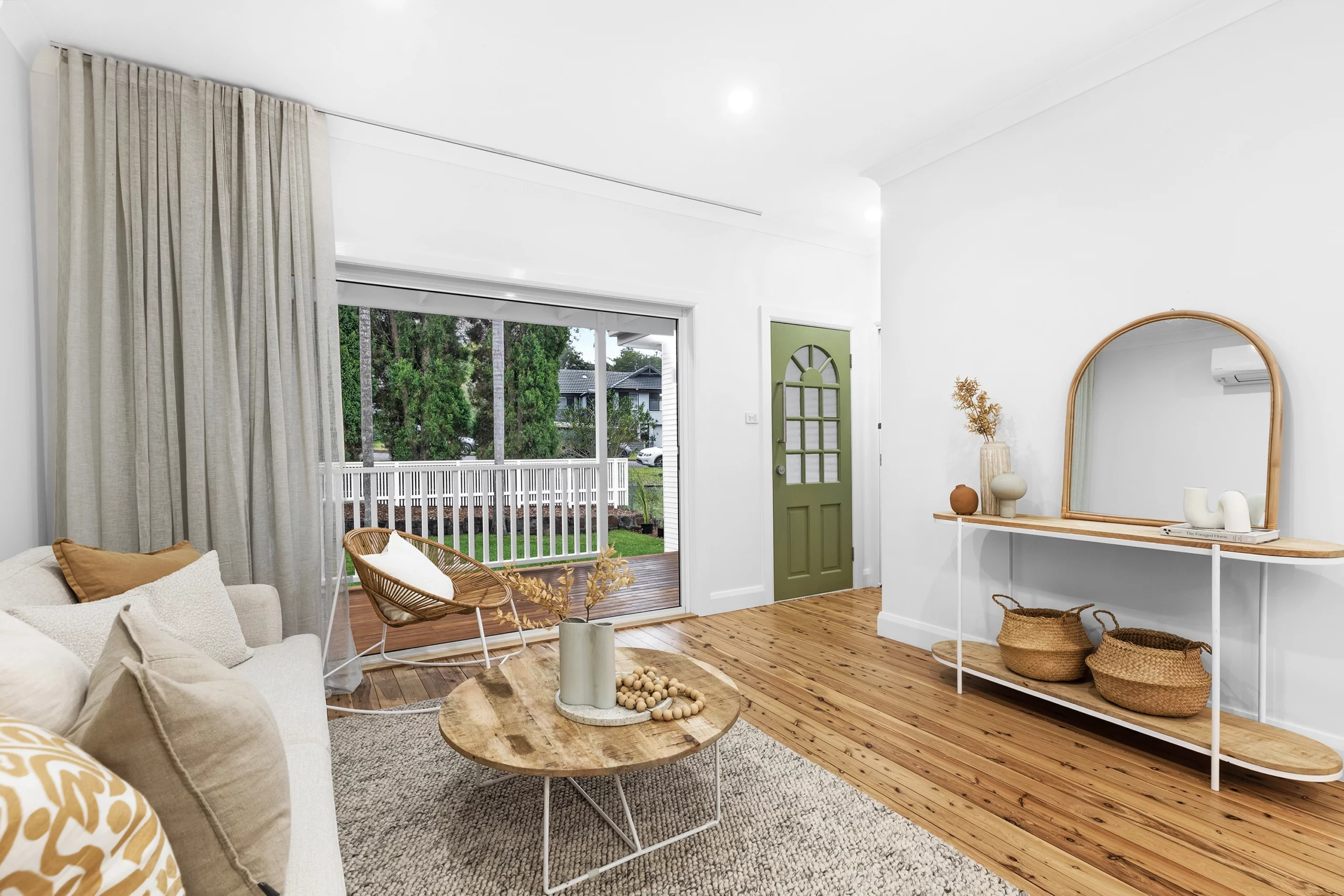 Contemporary open-plan living area renovation with large windows in a Newcastle residence