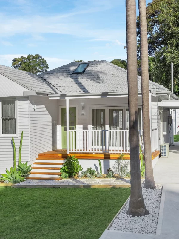 Refreshed home exterior with new cladding and updated roofing in Newcastle renovation